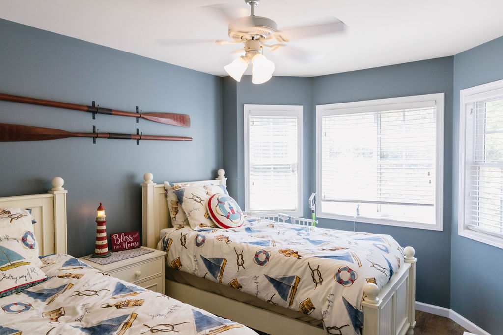 1230 Melton Road, Unit 87 West Union, SC 29696 - Photo 3 of 43 This cozy bedroom features bright windows and a ceiling fan, perfect for comfortable living.