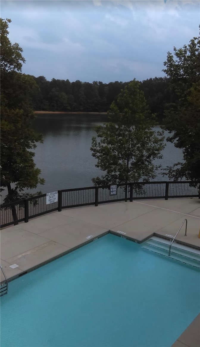 1230 Melton Road, Unit 87 West Union, SC 29696 - Photo 38 of 43 This tranquil outdoor space offers a refreshing pool and captivating lake views.