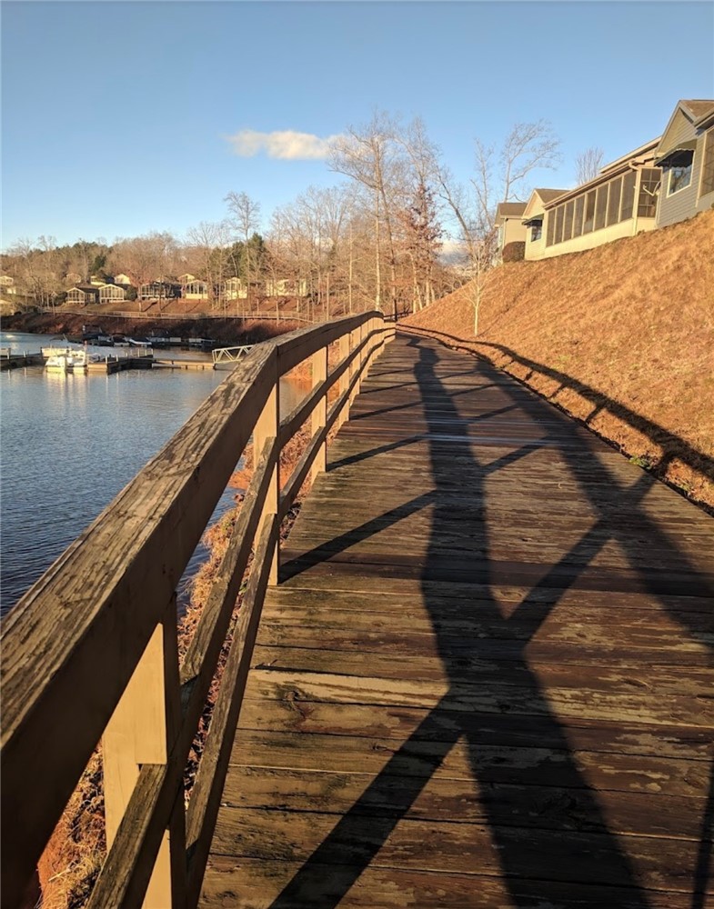 1230 Melton Road, Unit 87 West Union, SC 29696 - Photo 39 of 43 Walk along the lakeside boardwalk, enjoying the serene water views.
