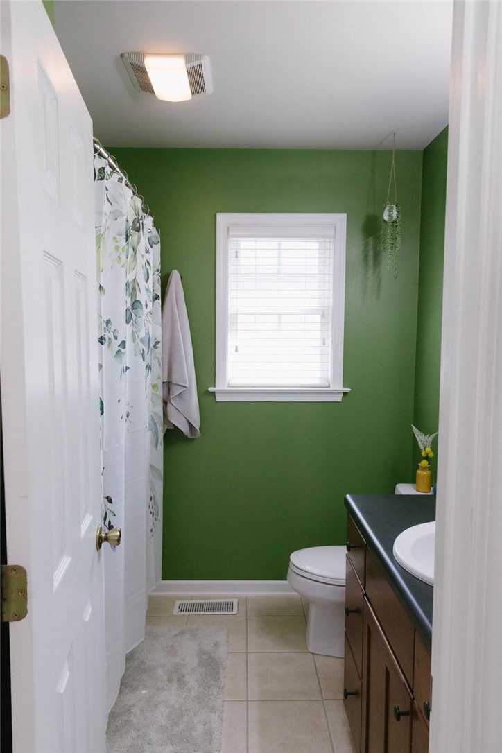 1230 Melton Road, Unit 87 West Union, SC 29696 - Photo 4 of 43 This functional bathroom features a neutral tile floor and a window providing natural light.