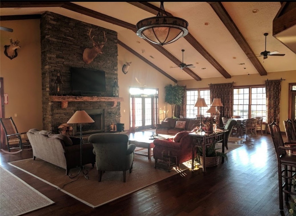 1230 Melton Road, Unit 87 West Union, SC 29696 - Photo 40 of 43 The community clubhouse features a grand stone fireplace and vaulted ceilings with exposed beams.