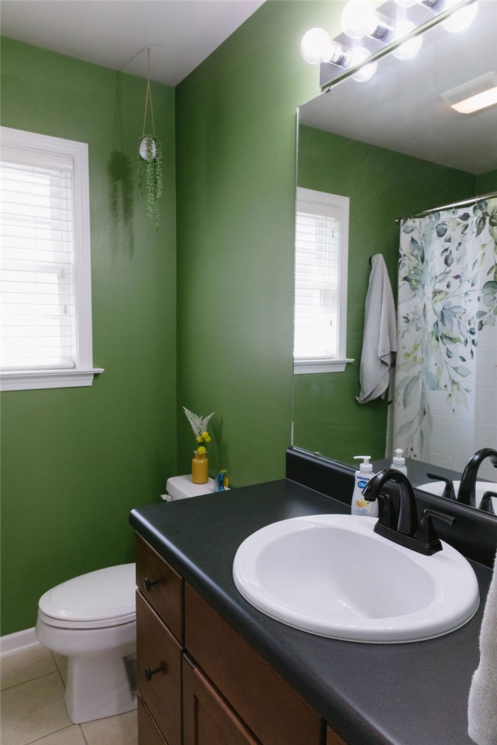 1230 Melton Road, Unit 87 West Union, SC 29696 - Photo 5 of 43 This bathroom features a sleek vanity and convenient toilet, offering a comfortable and practical space.