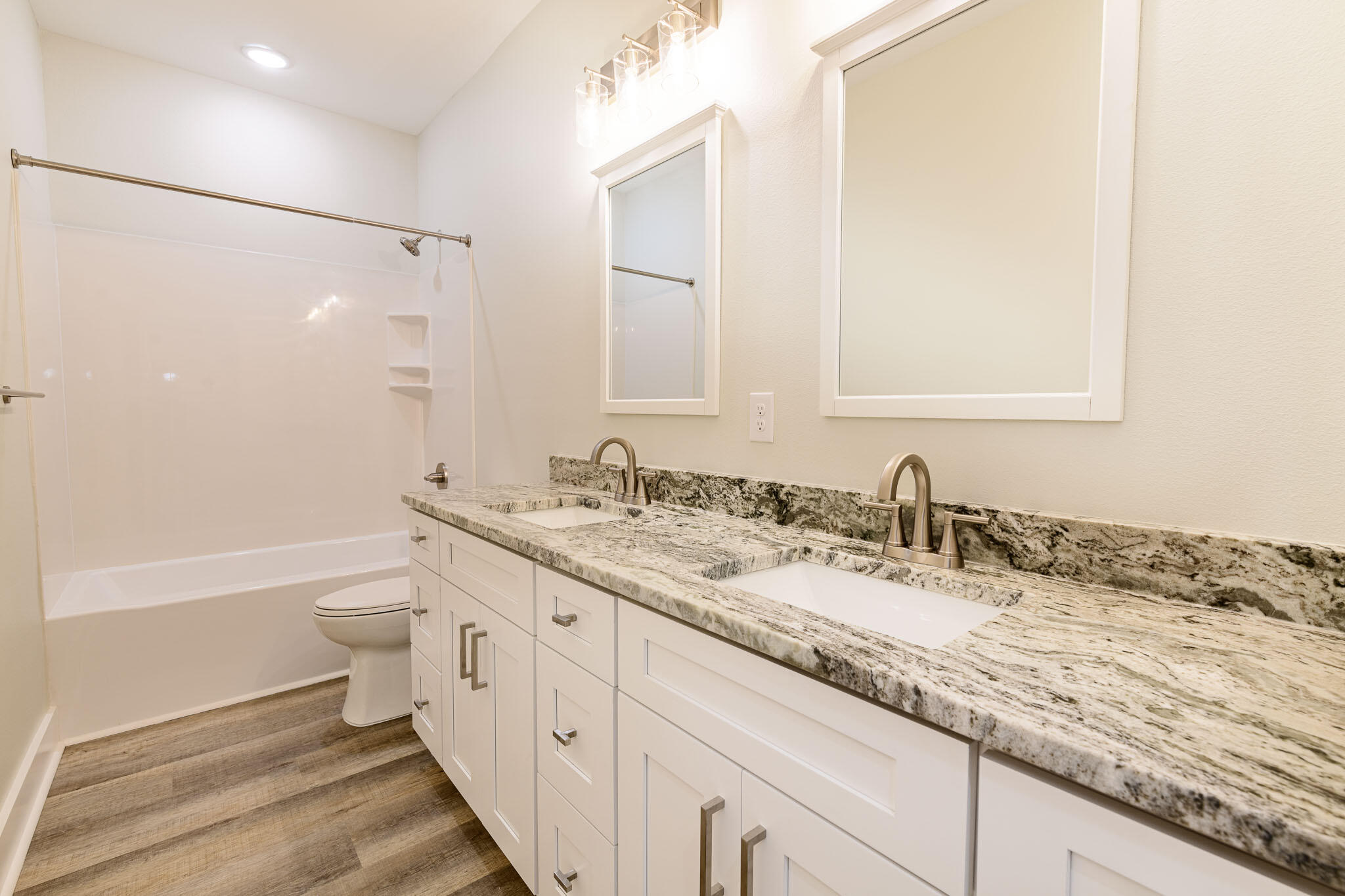 107 Clearing Way Valparaiso, FL 32580 - Photo 15 of 22 a bathroom with a granite countertop sink toilet and shower