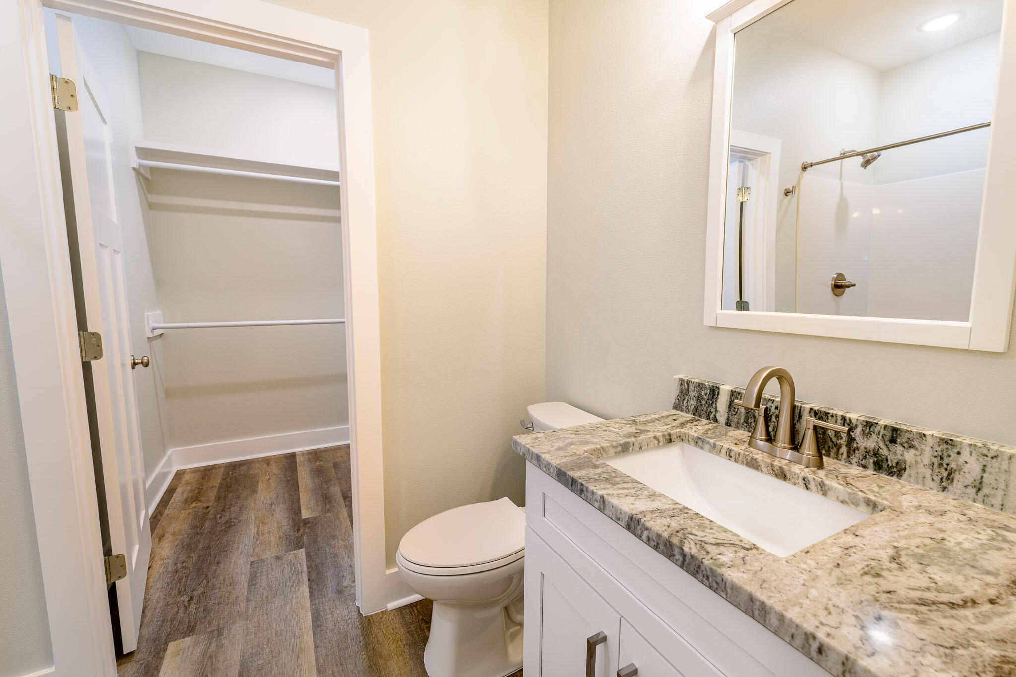 107 Clearing Way Valparaiso, FL 32580 - Photo 17 of 22 a bathroom with a granite countertop sink toilet and shower