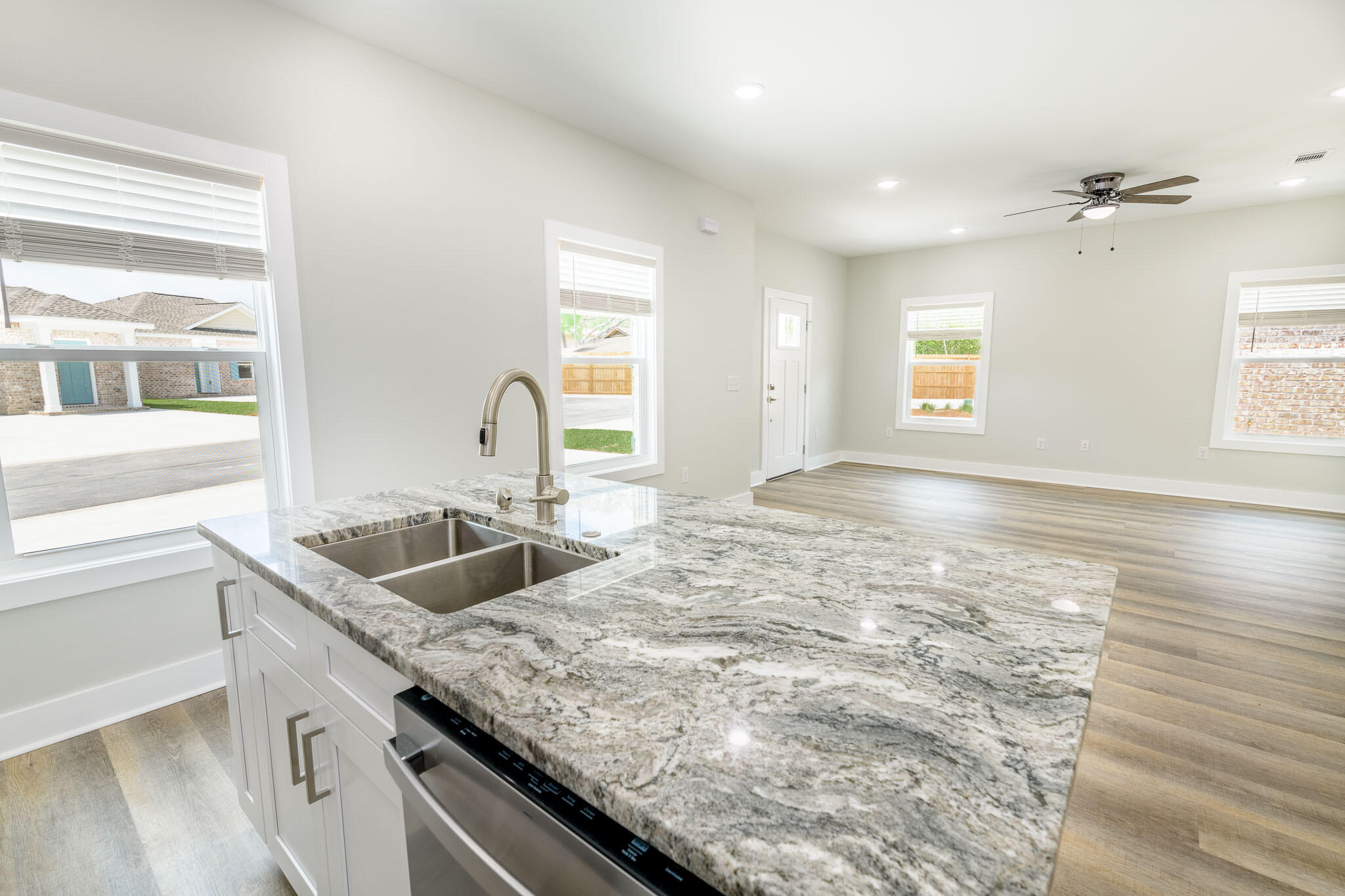 107 Clearing Way Valparaiso, FL 32580 - Photo 8 of 22 a kitchen with granite countertop a sink and a window