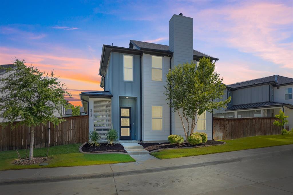 2125 Bird Street Fort Worth, TX 76111 - Photo 1 of 34 a front view of a house with garden