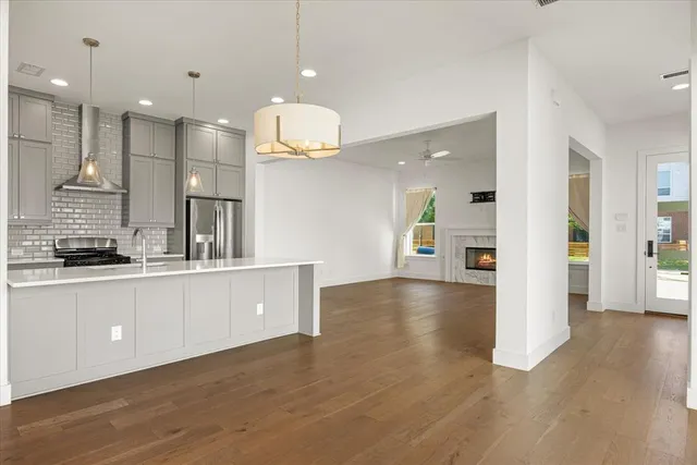 a large kitchen with stainless steel appliances kitchen island a large island in the center