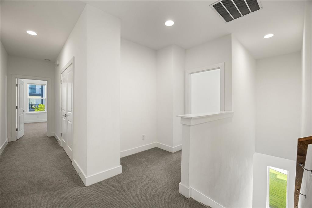 2125 Bird Street Fort Worth, TX 76111 - Photo 13 of 34 wooden floor in an empty room with a window