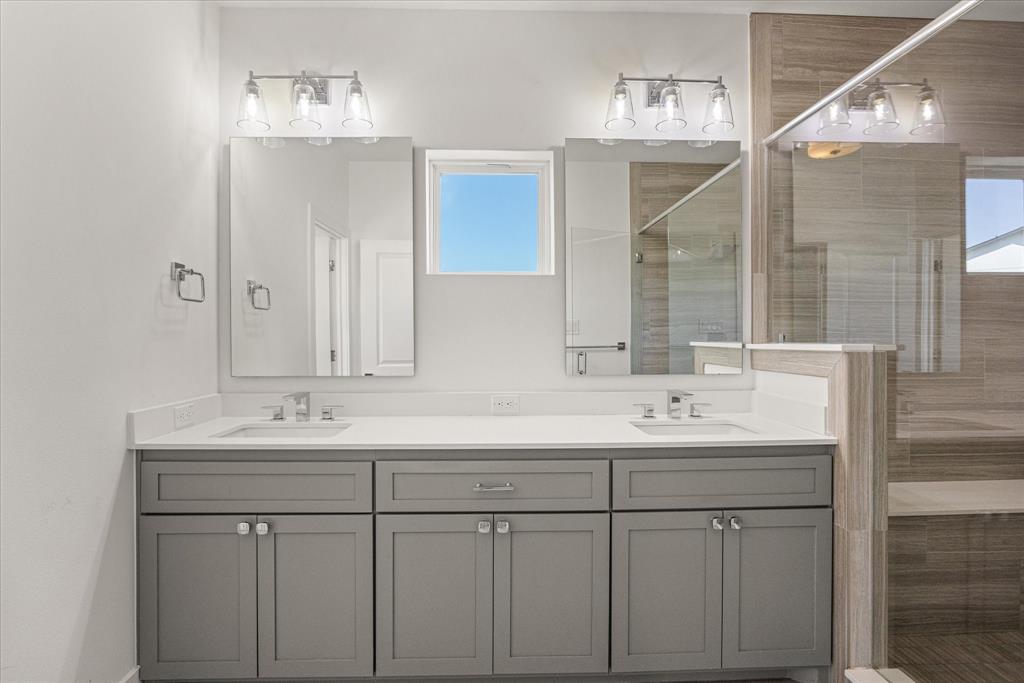 2125 Bird Street Fort Worth, TX 76111 - Photo 19 of 34 a bathroom with double sink and a mirror