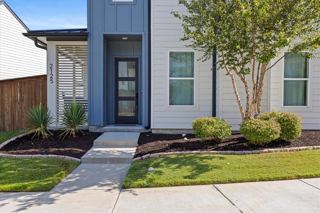 2125 Bird Street Fort Worth, TX 76111 - Photo 2 of 34 a front view of a house with a yard