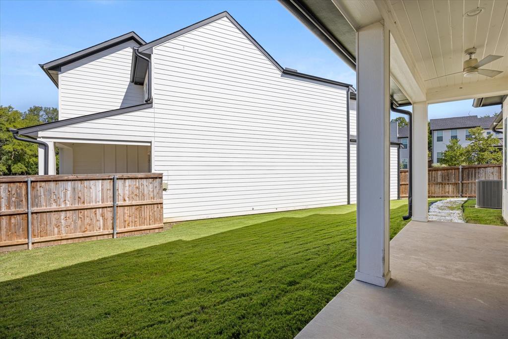 2125 Bird Street Fort Worth, TX 76111 - Photo 24 of 34 a view of a backyard with plants and large trees