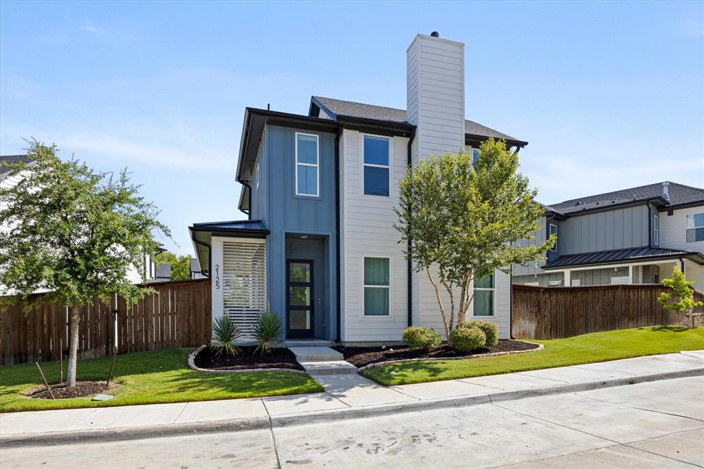 2125 Bird Street Fort Worth, TX 76111 - Photo 26 of 34 a front view of a house with garden and plants