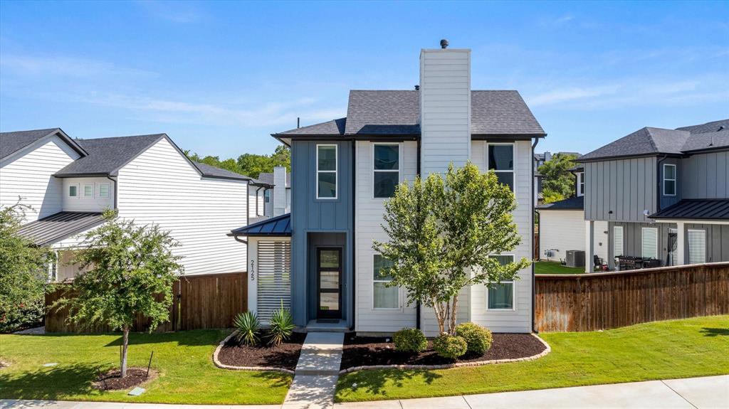 2125 Bird Street Fort Worth, TX 76111 - Photo 28 of 34 a front view of house with yard and trees in the background