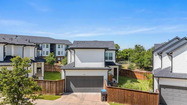 a view of house with outdoor space and sitting area