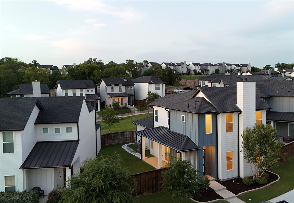 2125 Bird Street Fort Worth, TX 76111 - Photo 31 of 34 a front view of a house with a yard and garage