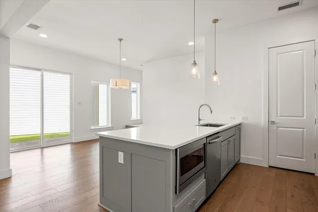 a kitchen with a sink and window