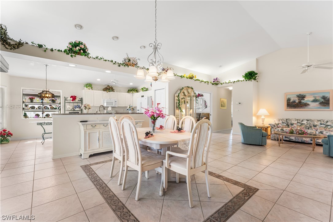 17536 Plumera Lane North Fort Myers, FL 33917 - Photo 11 of 50 a dining room filled with lots of furniture and chandelier