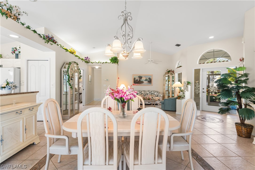 17536 Plumera Lane North Fort Myers, FL 33917 - Photo 12 of 50 a view of a dining room with furniture and chandelier