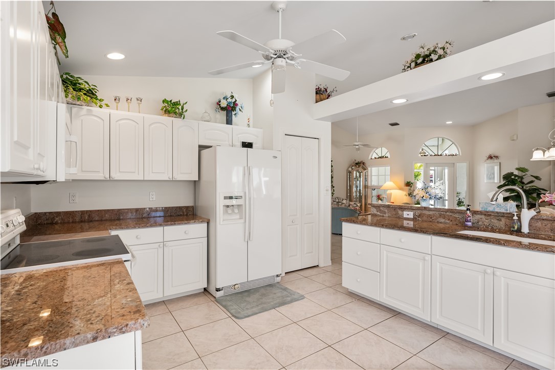 17536 Plumera Lane North Fort Myers, FL 33917 - Photo 16 of 50 a kitchen with white cabinets and sink
