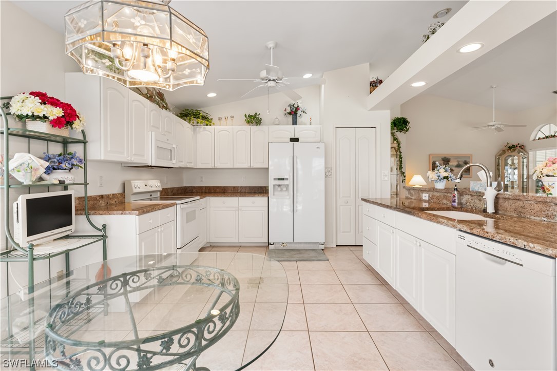17536 Plumera Lane North Fort Myers, FL 33917 - Photo 19 of 50 a large kitchen with granite countertop lots of counter top space and stainless steel appliances