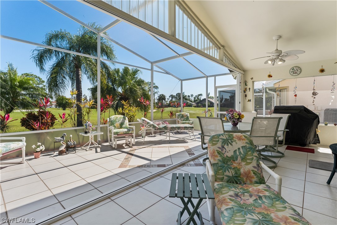 17536 Plumera Lane North Fort Myers, FL 33917 - Photo 21 of 50 a view of a patio with table and chairs under an umbrella