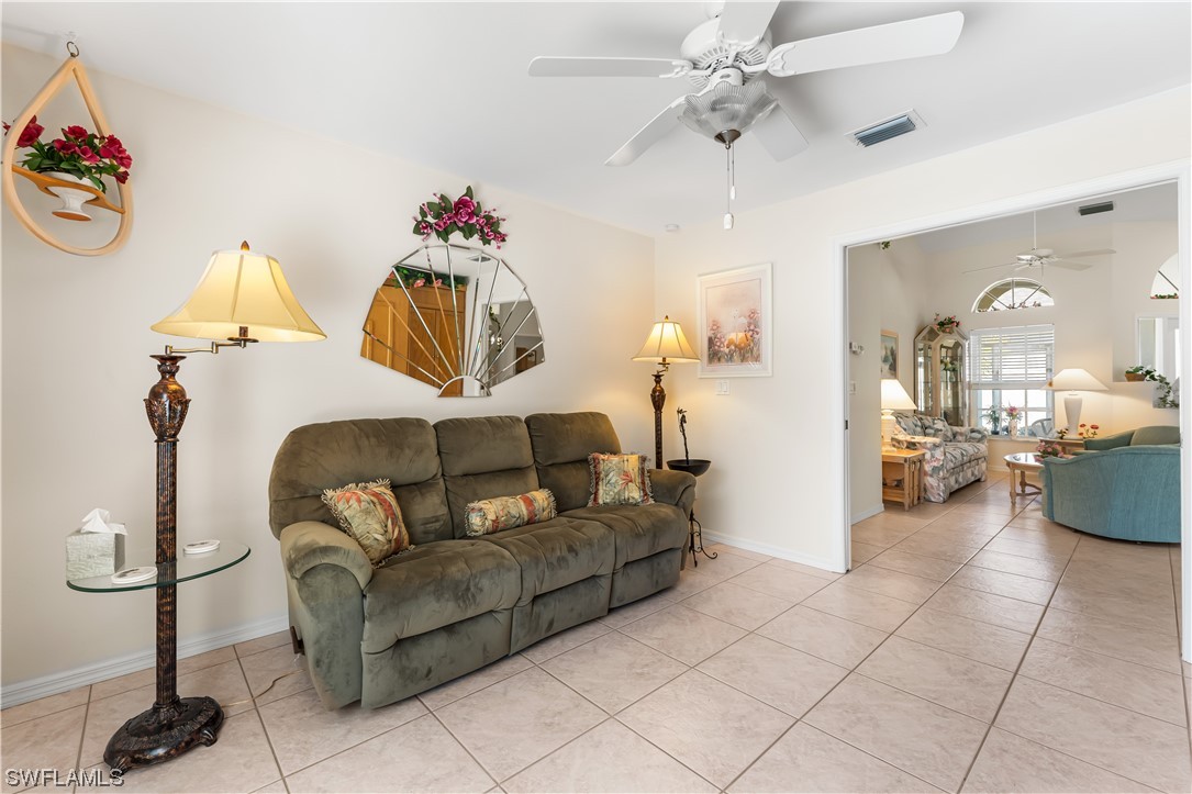 17536 Plumera Lane North Fort Myers, FL 33917 - Photo 25 of 50 a living room with furniture and a chandelier
