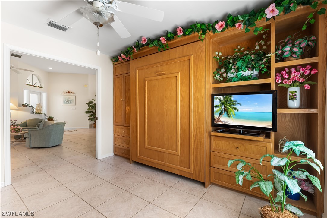 17536 Plumera Lane North Fort Myers, FL 33917 - Photo 26 of 50 a living room with furniture and a flat screen tv