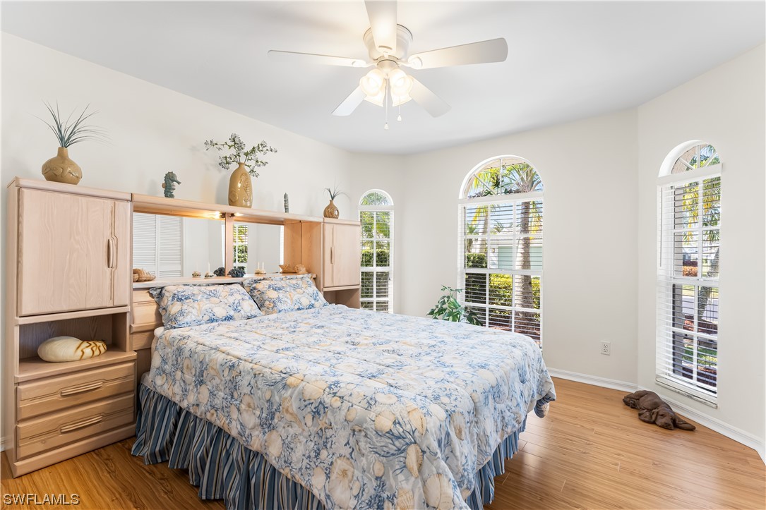 17536 Plumera Lane North Fort Myers, FL 33917 - Photo 27 of 50 a bedroom with a bed and a window