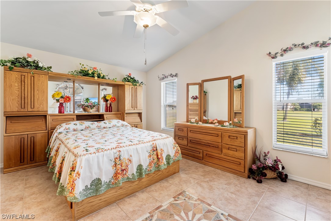 17536 Plumera Lane North Fort Myers, FL 33917 - Photo 30 of 50 a bedroom with a bed and a dresser