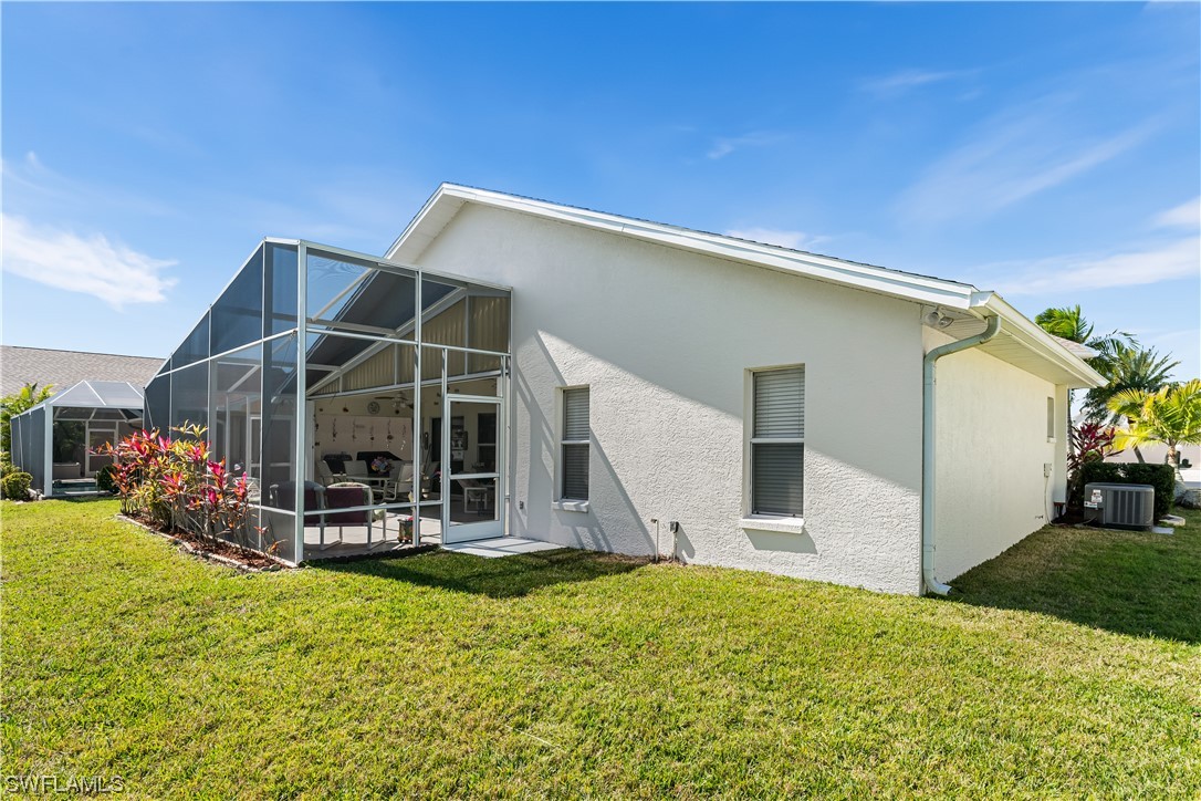 17536 Plumera Lane North Fort Myers, FL 33917 - Photo 38 of 50 a view of a house with backyard and porch