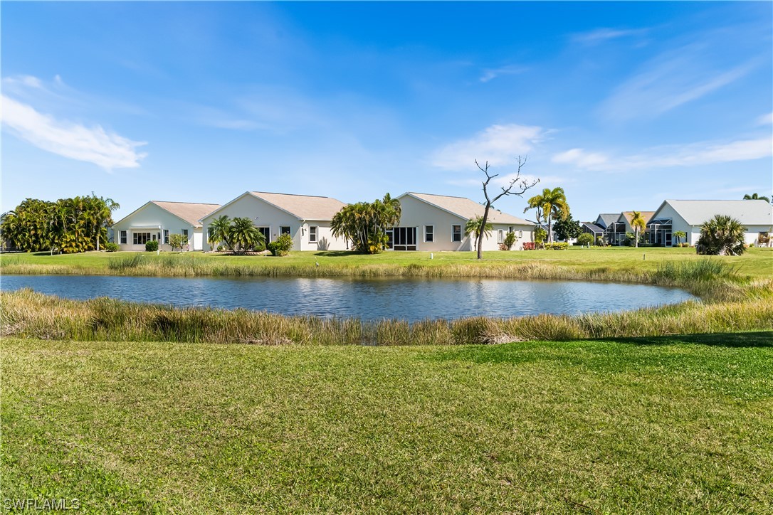 17536 Plumera Lane North Fort Myers, FL 33917 - Photo 39 of 50 a view of a lake with houses in the back