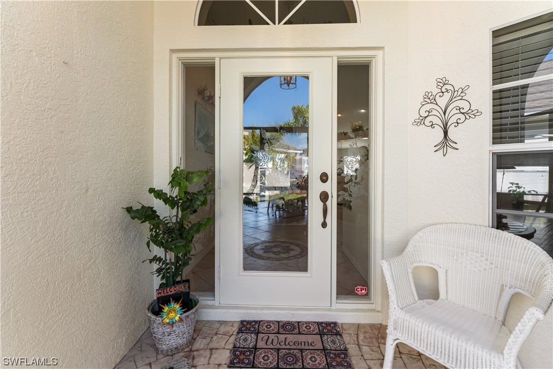 17536 Plumera Lane North Fort Myers, FL 33917 - Photo 4 of 50 a living room with furniture and flowers