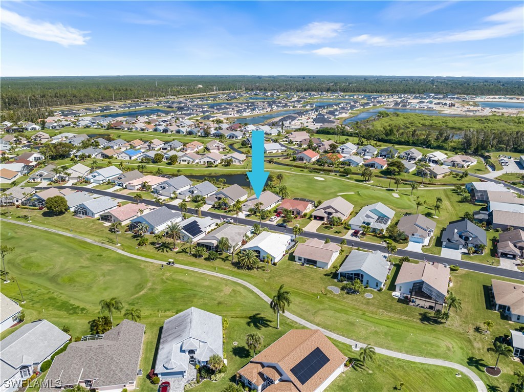 17536 Plumera Lane North Fort Myers, FL 33917 - Photo 41 of 50 an aerial view of a city with lots of residential buildings ocean and mountain view in back