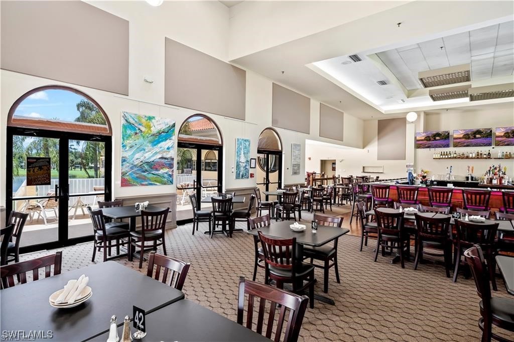 17536 Plumera Lane North Fort Myers, FL 33917 - Photo 46 of 50 a dinning area with lots of furniture and wooden floor