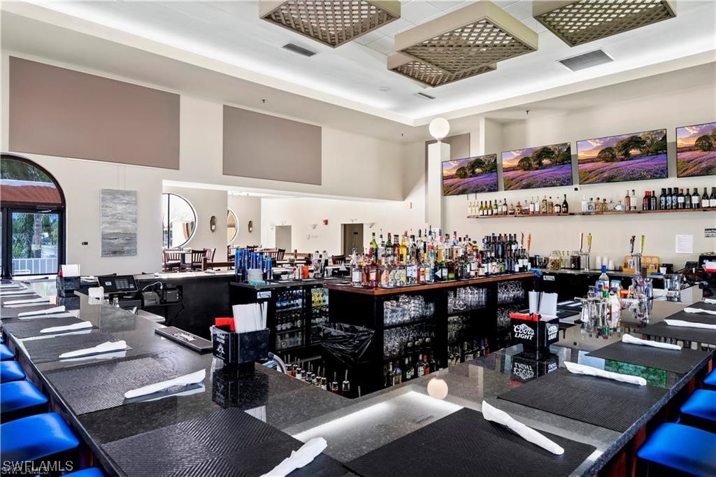 17536 Plumera Lane North Fort Myers, FL 33917 - Photo 47 of 50 a room with lots of chairs and lots of tables