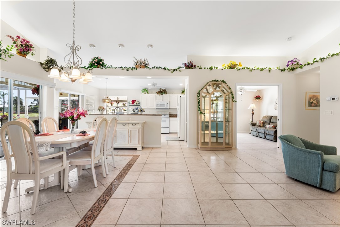 17536 Plumera Lane North Fort Myers, FL 33917 - Photo 6 of 50 a view of a living room and kitchen with furniture