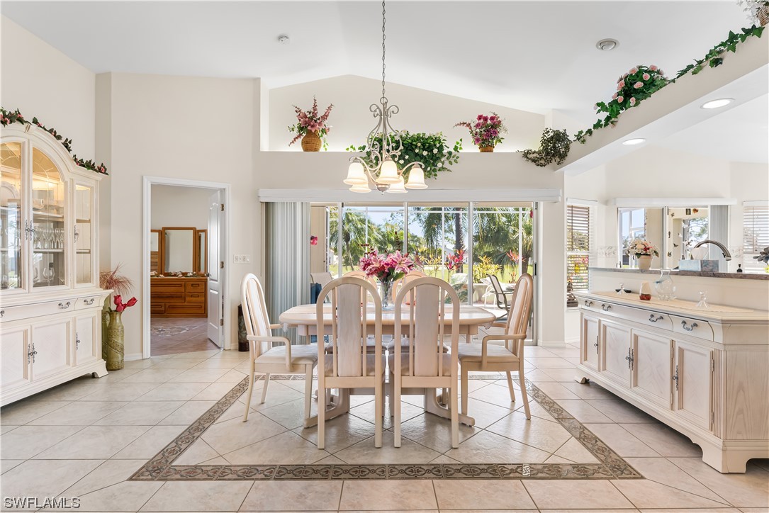 17536 Plumera Lane North Fort Myers, FL 33917 - Photo 10 of 50 a view of a dining room with furniture a livingroom and chandelier