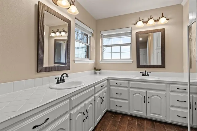 a bathroom with a sink and a mirror