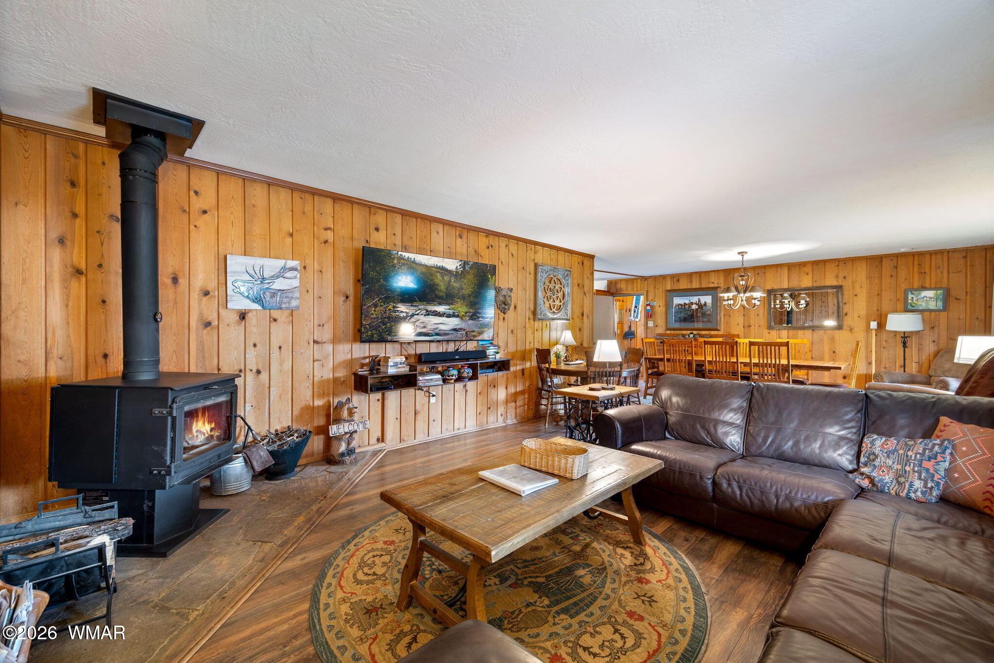 85 Main Street Greer, AZ 85927 - Photo 12 of 55 a living room with furniture and a flat screen tv