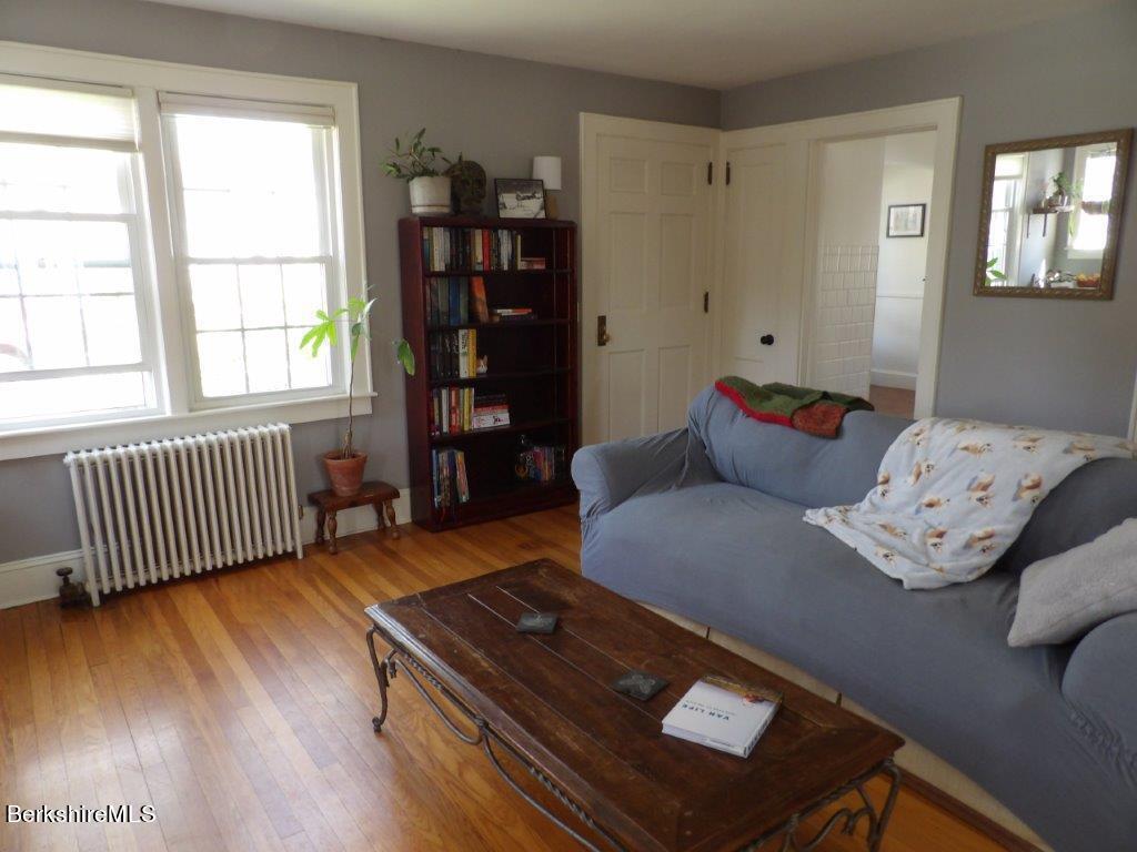 64 Cleveland Street Pittsfield, MA 01201 - Photo 12 of 32 a living room with furniture and a window