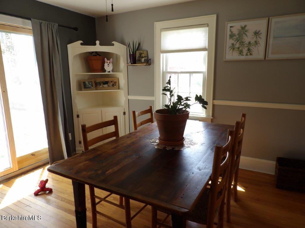 64 Cleveland Street Pittsfield, MA 01201 - Photo 14 of 32 a view of a dining room with furniture and a window