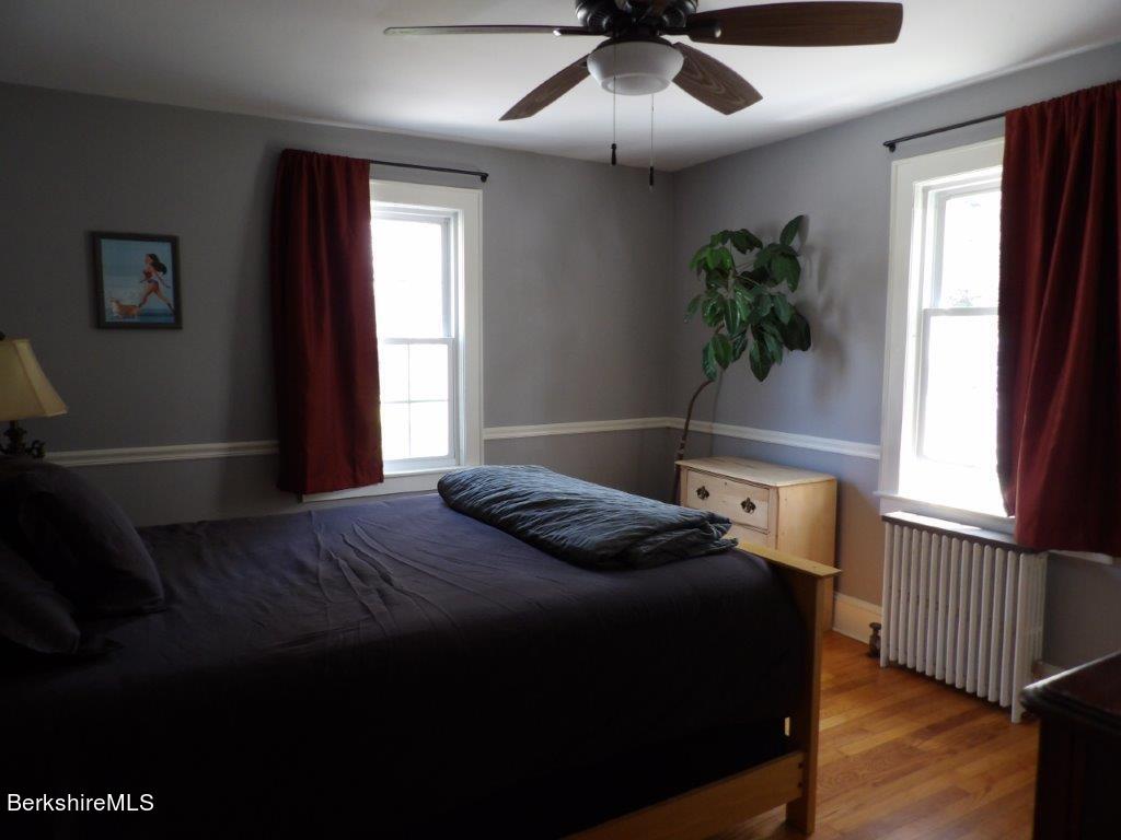 64 Cleveland Street Pittsfield, MA 01201 - Photo 16 of 32 a bedroom with a bed and a window