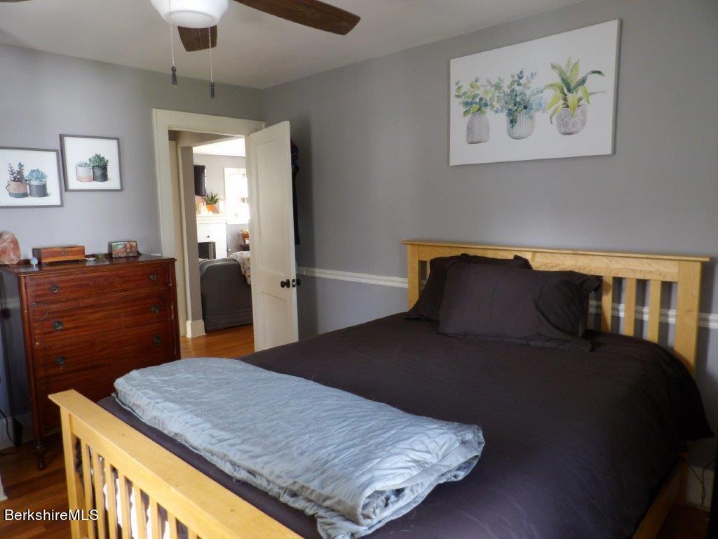 64 Cleveland Street Pittsfield, MA 01201 - Photo 18 of 32 a bedroom with a bed and dresser