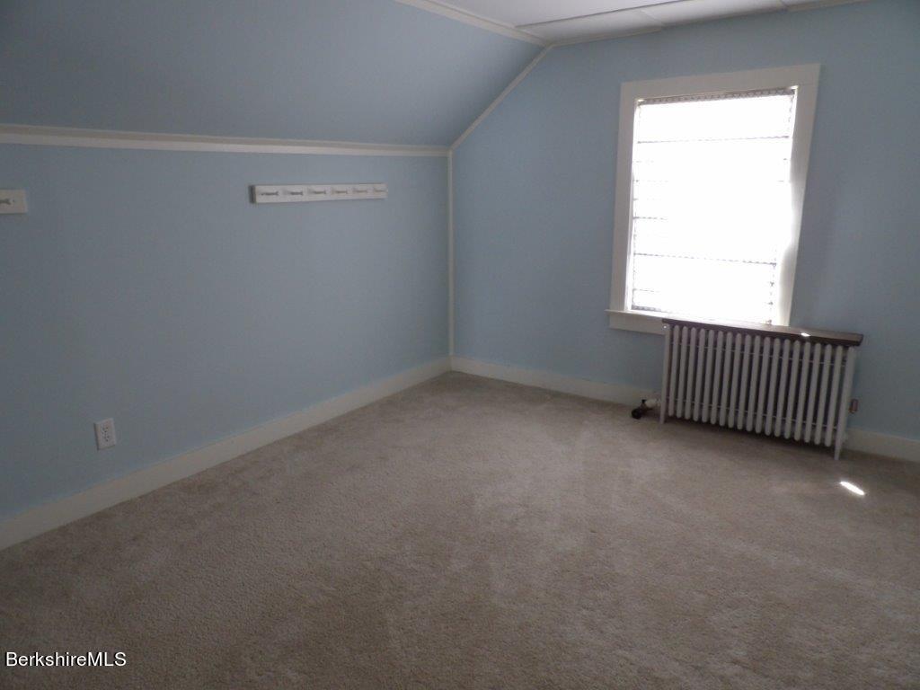 64 Cleveland Street Pittsfield, MA 01201 - Photo 22 of 32 an empty room with a window