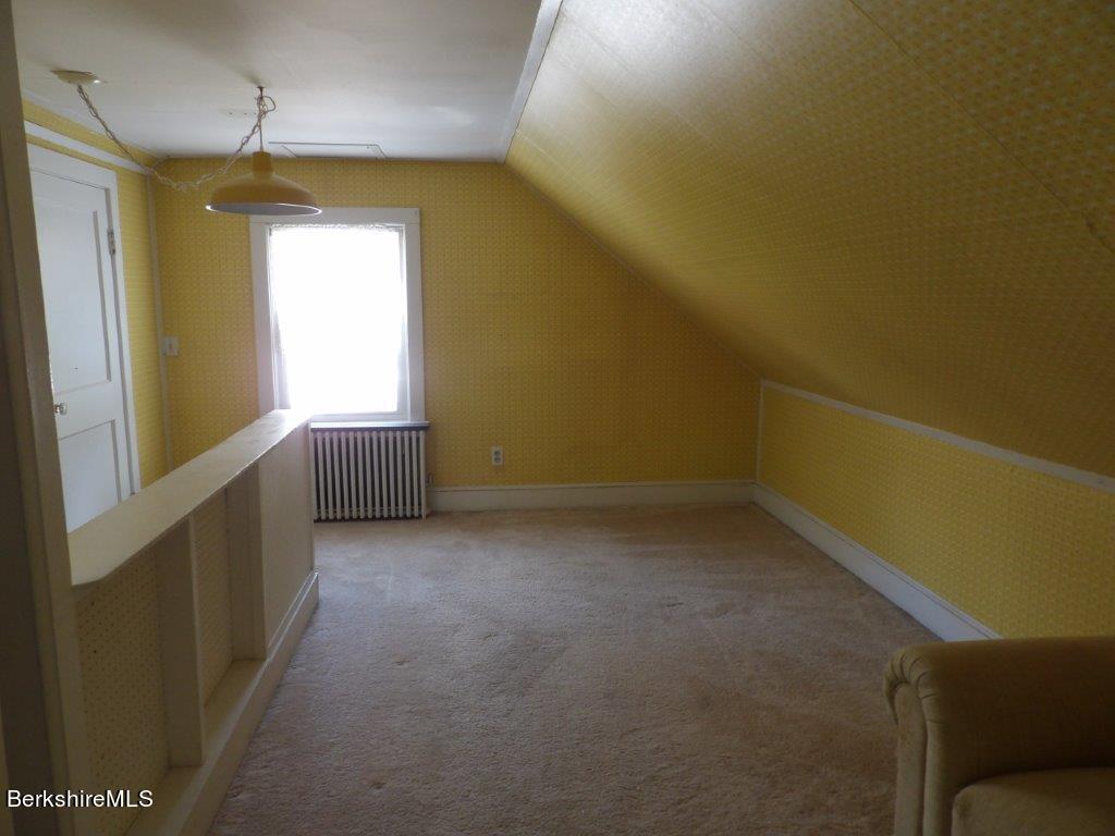 64 Cleveland Street Pittsfield, MA 01201 - Photo 23 of 32 a view of an empty room with a window
