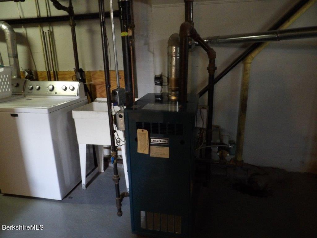 64 Cleveland Street Pittsfield, MA 01201 - Photo 27 of 32 a view of closet and microwave