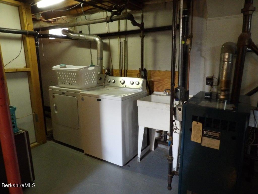 64 Cleveland Street Pittsfield, MA 01201 - Photo 28 of 32 a utility room with dryer and washer