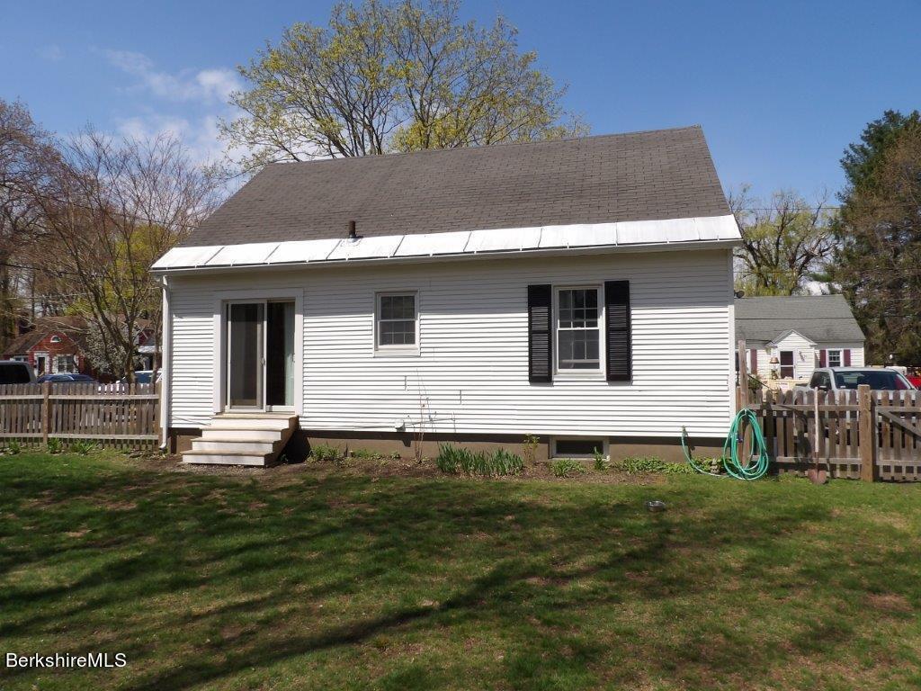 64 Cleveland Street Pittsfield, MA 01201 - Photo 29 of 32 a front view of a house with a yard