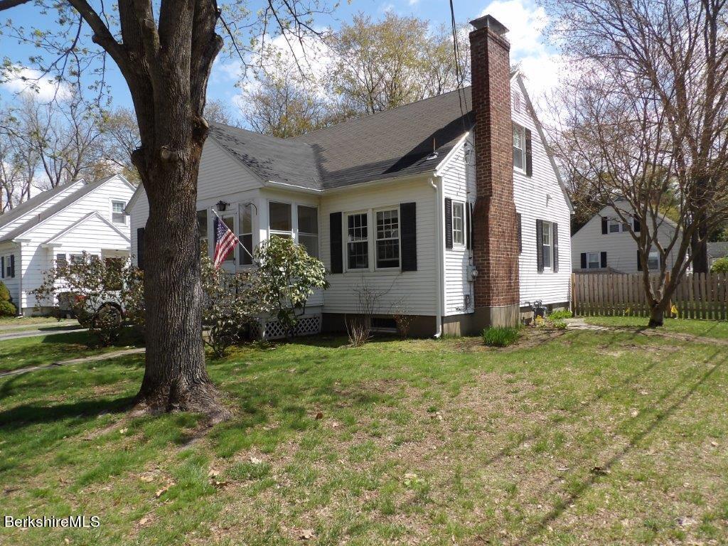 64 Cleveland Street Pittsfield, MA 01201 - Photo 3 of 32 a front view of a house with garden
