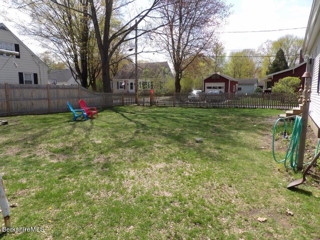 64 Cleveland Street Pittsfield, MA 01201 - Photo 31 of 32 a backyard of a house with table and chairs